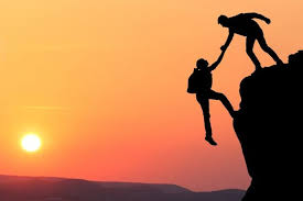 two rock climbers at sunset